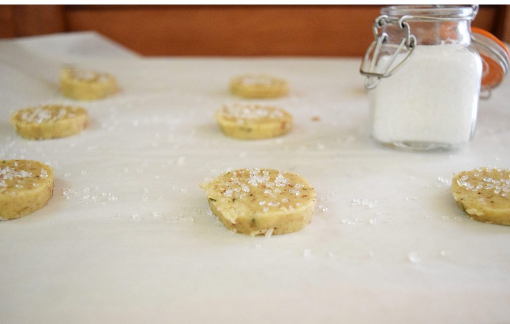 Brown Butter Rosemary Shortbread Cookies: Rosemary shortbread cookies sprinkled with salt laid out before baking