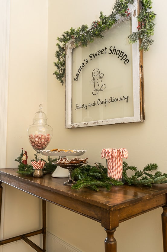 Easy to make DIY Painted Window. Add a little bakery shop charm to your Christmas decorations with this Santa's Sweet Shoppe window.