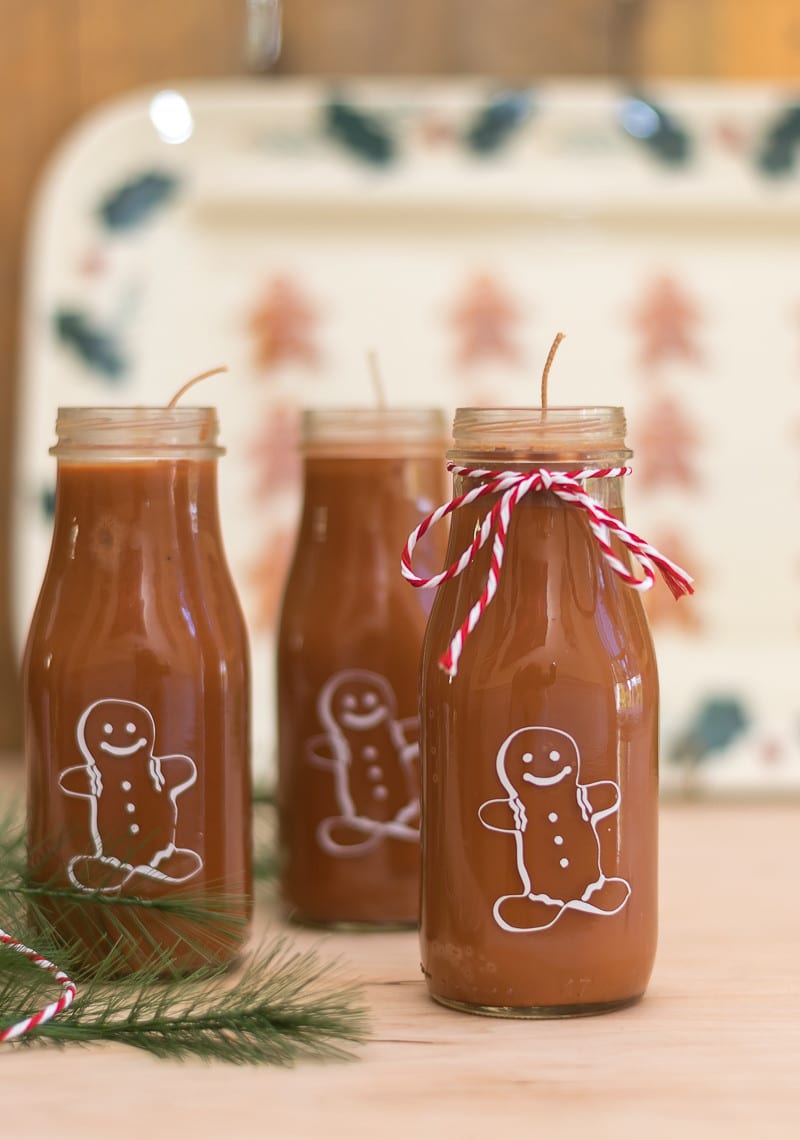 Easy to make Gingerbread Man Candles. Upcycled Starbucks Frappuccino bottles and Cricut Explore Air make these a fun project.