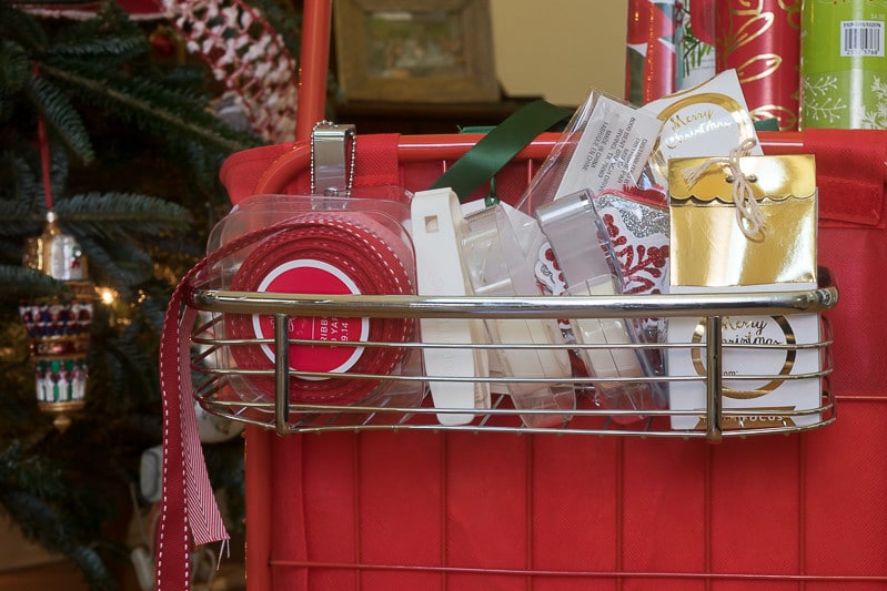 DIY Christmas Wrapping Paper Organizer: Tape and wrapping doo dads are tucked in the front storage unit of my wrapping paper cart.