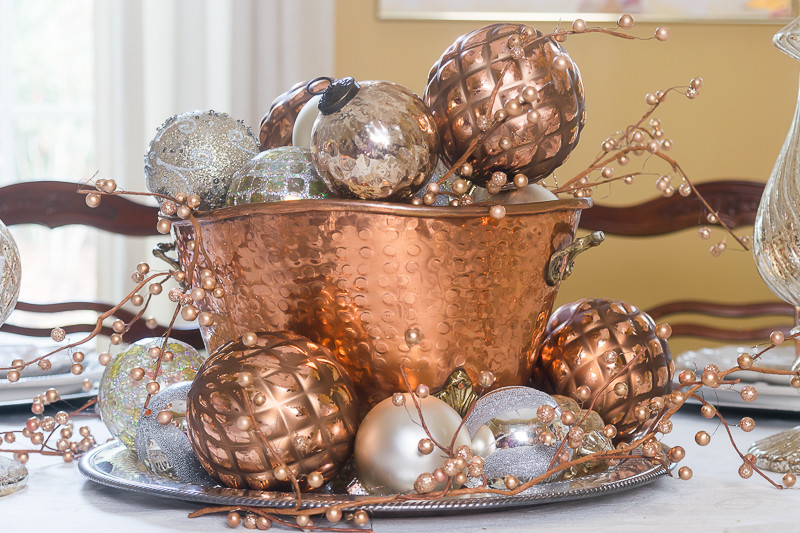 Copper pot with mixed metal ornaments