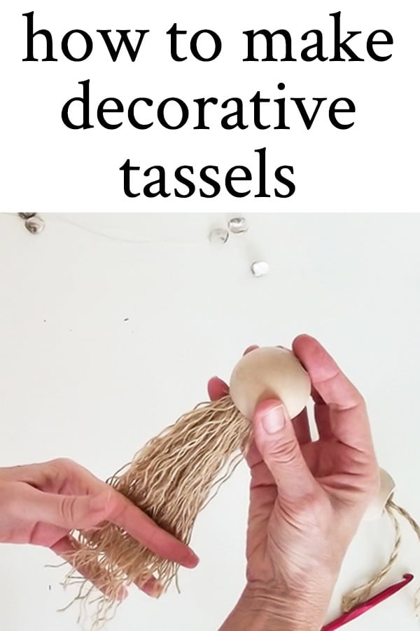 hand showing how to make decorative tassels