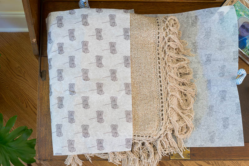 linen stitch knit blanket with crochet fringe in tissue paper