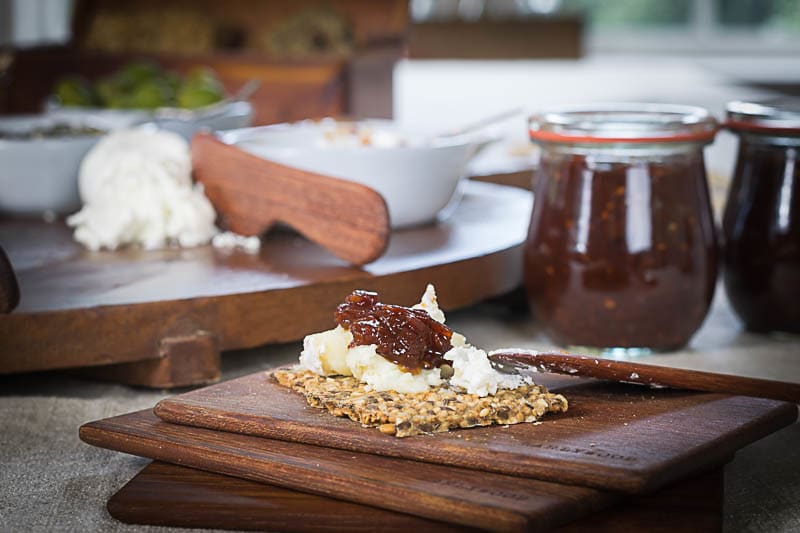 Smoky Spicy Tomato Jam Recipe spread on Goat Cheese and Crackers