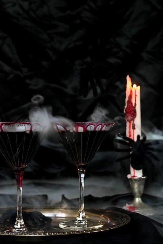 Black Widow Halloween Martini : black martinis on platter with bubbling smoke and dripping 